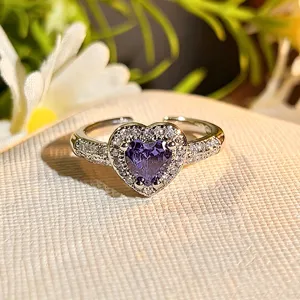 Close-up detail of the sparkling heart-shaped purple zirconia open ring with dainty micro-pave.