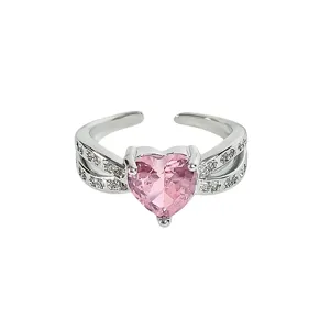 Pink heart zircon open ring detail, sparkling double band, elegant women jewelry piece.