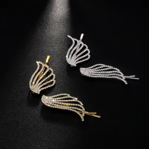 Rhinestone angel wing hair clip detail showcasing sparkling crystal stones and design.