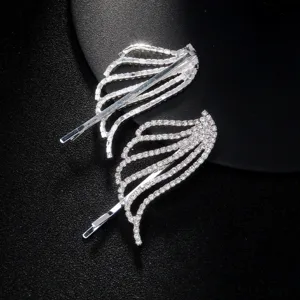 Rhinestone angel wing hair clip detail shot, sparkly silver bobby pin for side bangs.