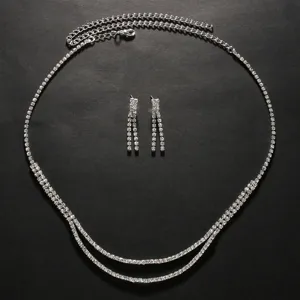 Detailed view of silver rhinestone double layer necklace and matching drop earrings set.