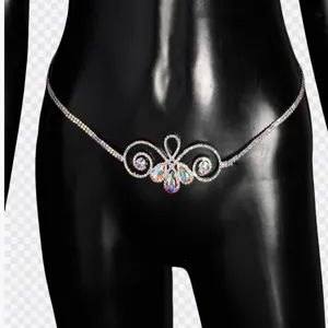 Detailed close-up of sparkling rhinestone body chain, intricate metallic crystal waist jewelry.