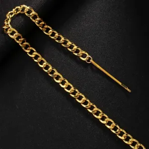 Gold metal hair chain detail, punk style tassel braid accessory for party and festival styling.
