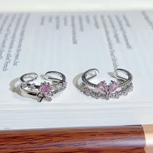 Silver open ring set with pink zirconia, featuring cute bow and heart details for sweet style.