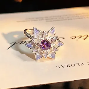 Exquisite purple zircon flower open ring detail close-up showcasing unique sparkle.