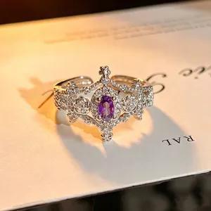 Exquisite detailed close-up of a hollow floral open ring featuring a sparkling purple oval zircon.
