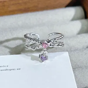 Exquisite silver open ring with pink and purple zircon, unique branch texture detail.