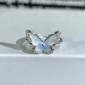 Trendy silver butterfly open ring with blue enamel and sparkling cubic zirconia for women.