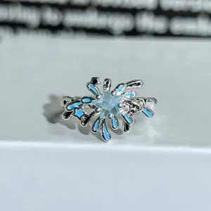 Silver open ring featuring a blue star cubic zirconia and vibrant blue enamel details.