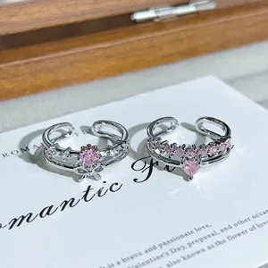 Stunning pink zirconia double-layer open ring with cute bow and heart charm for women.