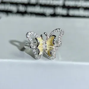 Silver butterfly ring with sparkling cubic zirconia and yellow enamel accent for women.