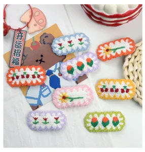 Cute handmade crochet hair clips with floral and cherry designs, sweet candy colors for girls.