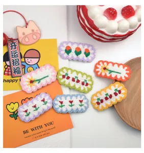 Cute handmade crochet hair clips with colorful floral and cherry designs for sweet girls.
