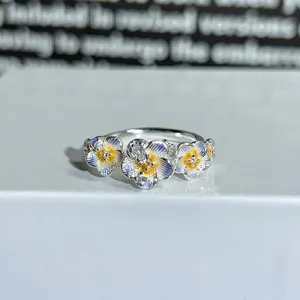 Detailed close-up of the colorful enamel flower open ring, showcasing exquisite ring craftsmanship.