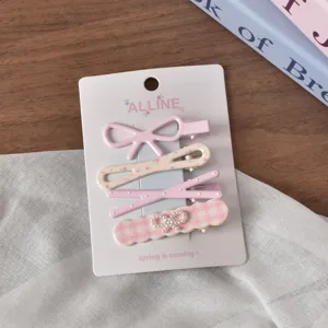 Detailed view of sweet pink hair clip set with cute bows and floral patterns, daily accessories.