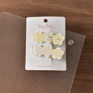 Close-up detail of the cute floral bow hair clip set, showing exquisite resin texture and pattern.