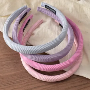 Detail shot of Korean style striped sponge headband, soft texture, elegant hair accessory for women.