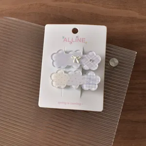 Detailed view of cute sweet style plaid and floral hair clips set with charming details.