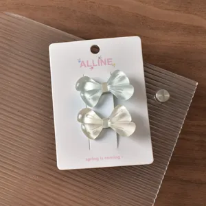 Cute bow hair clips set, translucent dual-color duckbill hairpins for sweet daily styling.