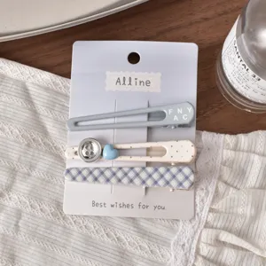 Close-up detail of the sweet college style hair clip set, featuring cute blue and plaid designs.