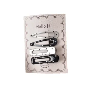 Cute Y2K polka dot hair clips set, black and silver snap hair pins for women and girls daily styling.