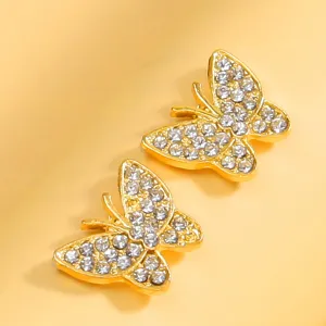 Squisiti copricapezzoli a farfalla in strass dorato, adesivi per il corpo scintillanti chic.