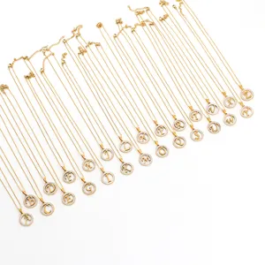 Gold 26 alphabet letter pendant necklaces set, elegant rhinestone circular charm jewelry.
