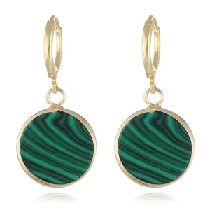 Detailed shot of vintage gold-plated round green malachite drop earrings for women.