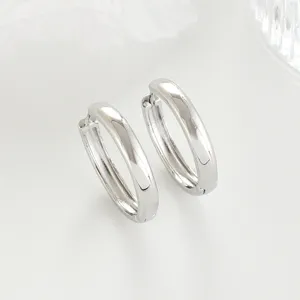 Chic silver hoop earrings detailed view, minimalist French style metal jewelry for women.