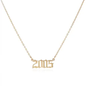 Gold stainless steel 2005 year number pendant necklace aesthetic vintage jewelry detail shot.
