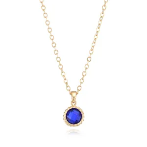 Close-up of gold-plated clavicle chain with a round blue gemstone pendant detail.
