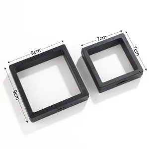 Detailed view of black square floating jewelry display frames, showing size and film structure.