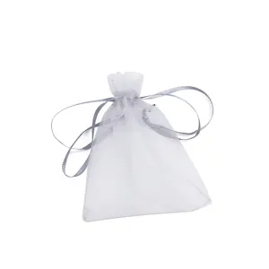 Grey organza pouch detail, sheer fabric bag with drawstring closure for gift and jewelry.