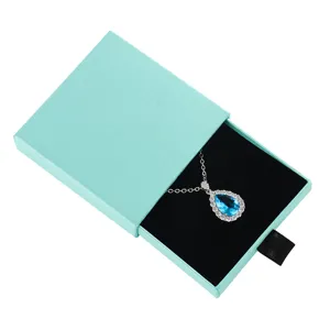 Drawer jewelry gift box with velvet interior, elegant blue packaging for necklace and ring storage.