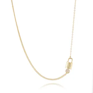 Detailed view of the gold-plated lock and key pendant necklace with sparkling zirconia 'D'.