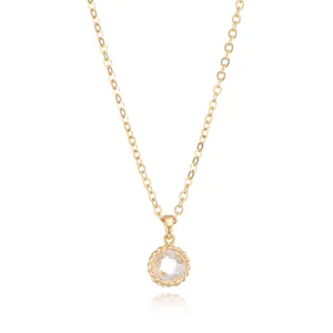 Exquisite gold plated crystal pendant necklace detail shot, sparkling cubic zirconia stone.