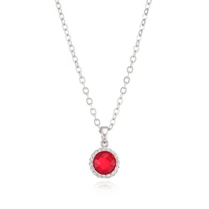 Elegant silver chain necklace featuring a stunning red birthstone pendant with chic edge.