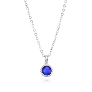Close-up detail of the elegant blue gemstone pendant necklace showcasing delicate chain and sparkle.