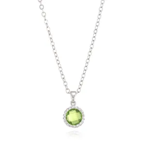 Close-up view of a green gemstone pendant necklace with a delicate silver chain.