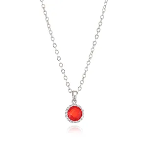 Detail view of the elegant birthstone pendant necklace featuring a vibrant red faceted gemstone.