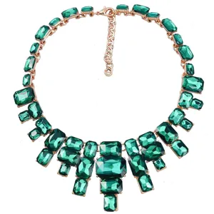 Exquisite green rhinestone statement necklace detail, sparkling square crystals with rose gold metal.