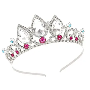Detailed view of sparkly rhinestone tiara with teardrop crystals and pink gems for hair styling.