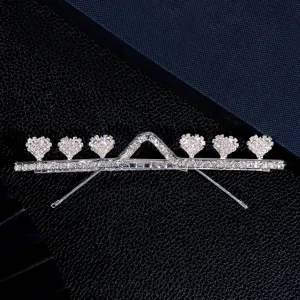 Rhinestone heart hair clip detailed shot, sparkling silver fashion metal face accessory style.