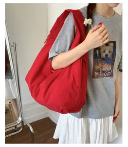 Casual red canvas tote shoulder bag for women, large capacity relaxed everyday underarm bag.