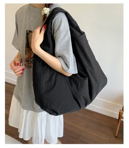 Japanese style casual large black tote bag, spacious underarm shoulder bag for women daily commute.