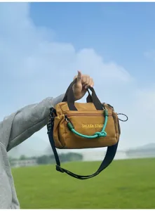 Multifunctional outdoor canvas crossbody bag, casual travel handbag with large capacity.
