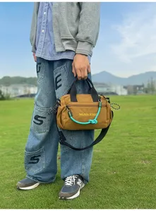 Multifunctional outdoor sports canvas crossbody bag, casual commuter handbag for daily travel.