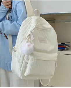Sac à dos blanc plissé de style doux pour le collège et le travail avec pompon en peluche.