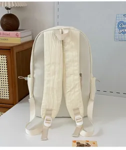 Sac à dos minimaliste de couleur unie pour école et trajet quotidien, cartable étudiant chic.