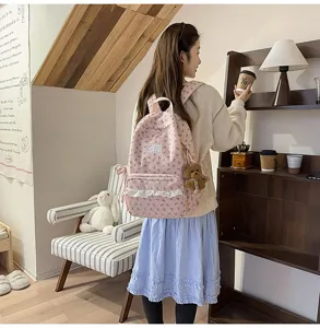 Pink corduroy backpack for women, cute lace trim, lightweight casual student schoolbag.